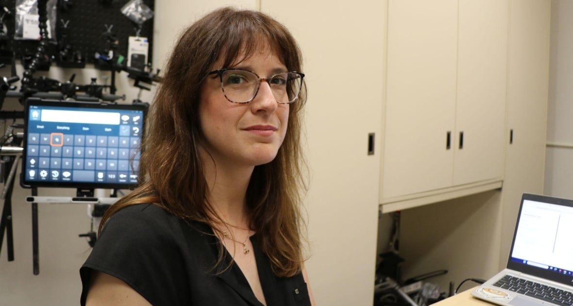 A woman looks at the camera